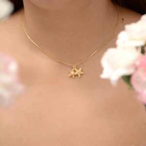 CADENA ESTRELLA CON PERLA MINI Y BRILLO