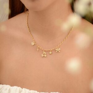 CADENA CORAZÓN CRUZ ESTRELLA CEREZA MOÑO
